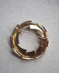 Round Spinning Gold Tone Brooch